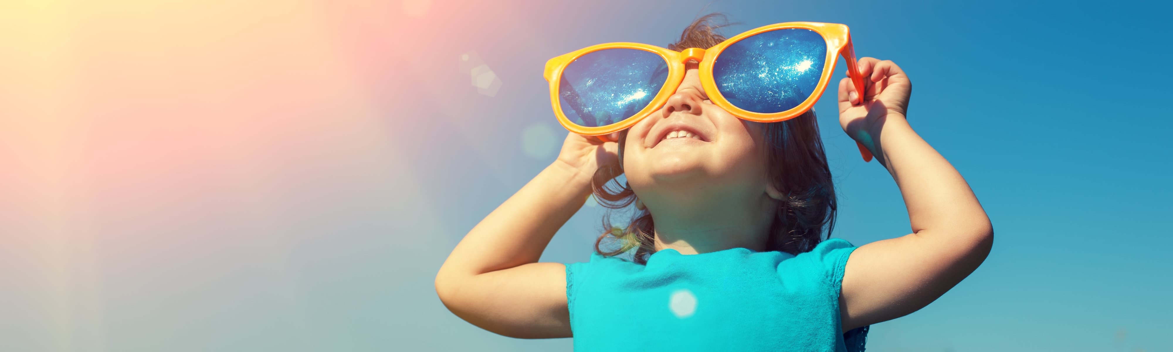 Kid wearing oversized sunglasses.